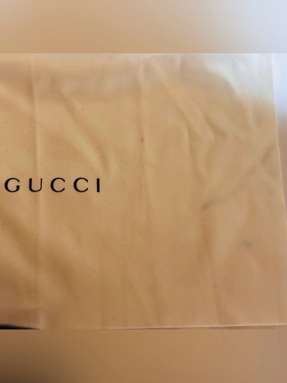 A Gucci Eyewear Case in Black and Dark Gray with Gold Logo